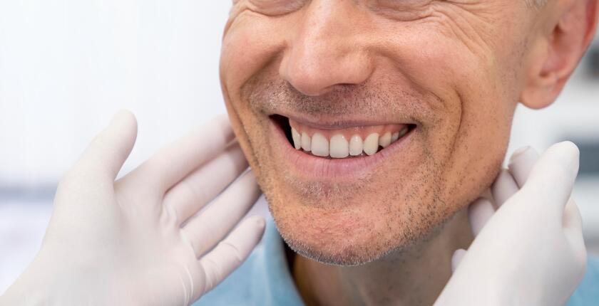 Patient receiving oral surgery aftercare instructions at Antalya Smile Designs.