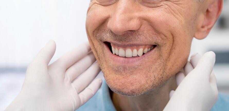 Patient receiving oral surgery aftercare instructions at Antalya Smile Designs.