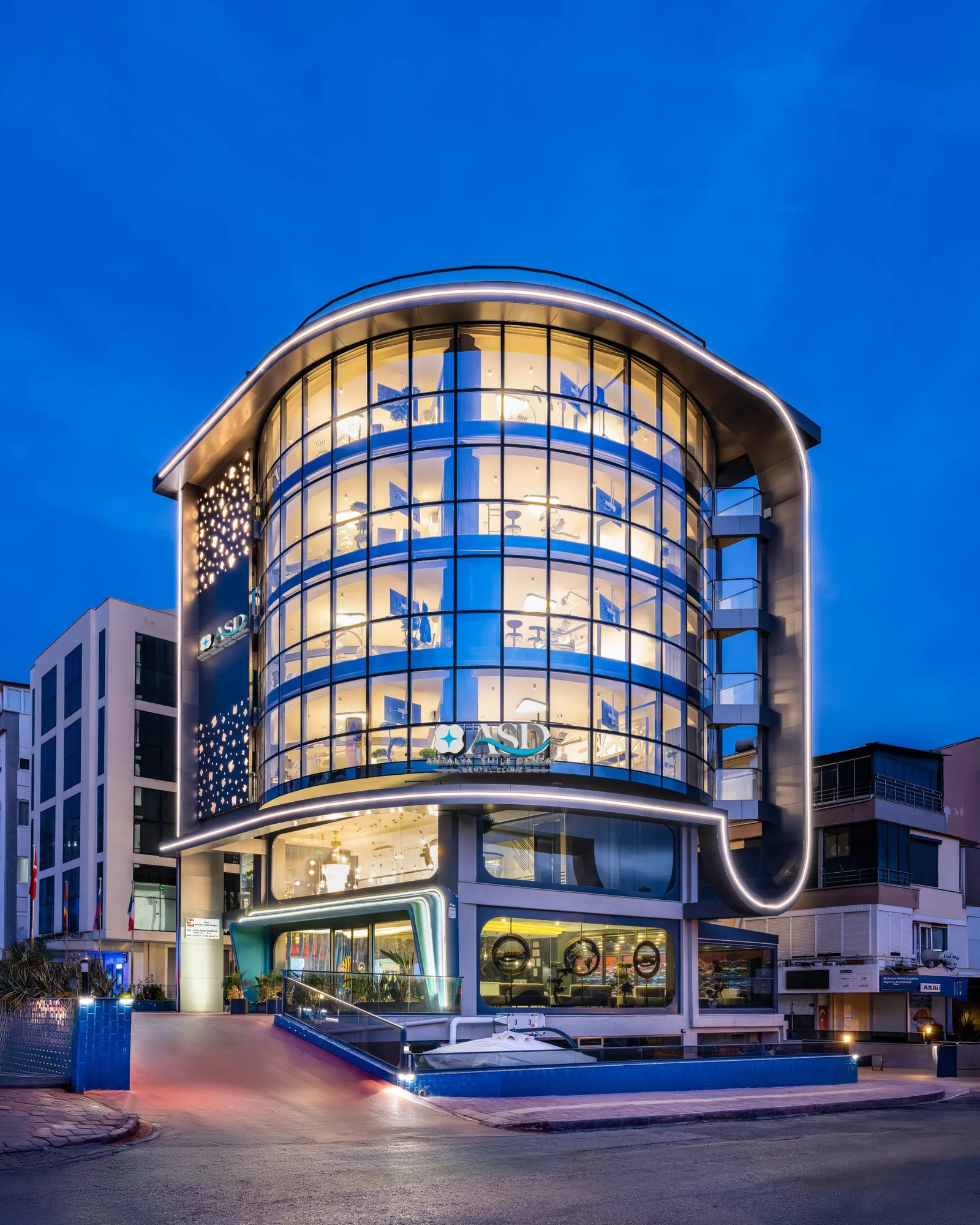 Antalya Smile Designs clinic building in Konyaaltı at dusk
